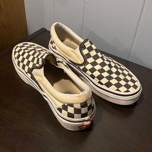 Black checkered slip on vans